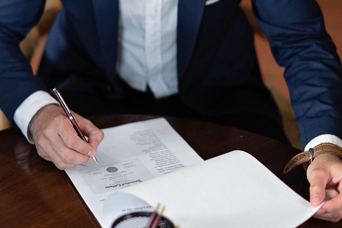 Taxpayer signing an IRS installment agreement, monthly payment plan for back taxes in Corpus Christi TX