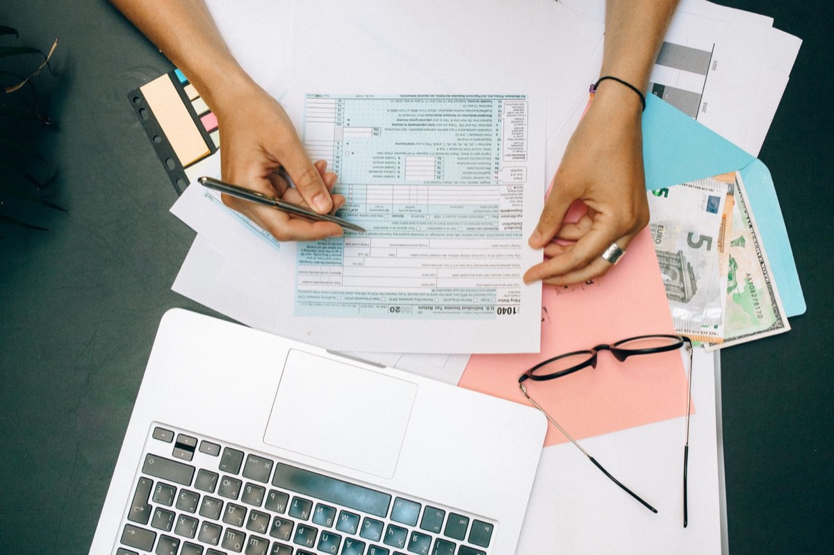 Taxpayer completing IRS forms to request penalty abatement, reduce IRS failure to file and failure to pay penalties in Texas