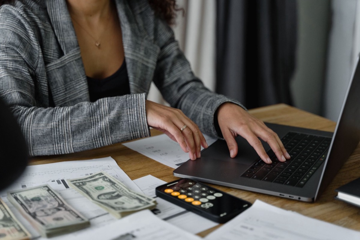 Small business owner working on payroll tax records to resolve IRS trust fund recovery penalty in Corpus Christi TX